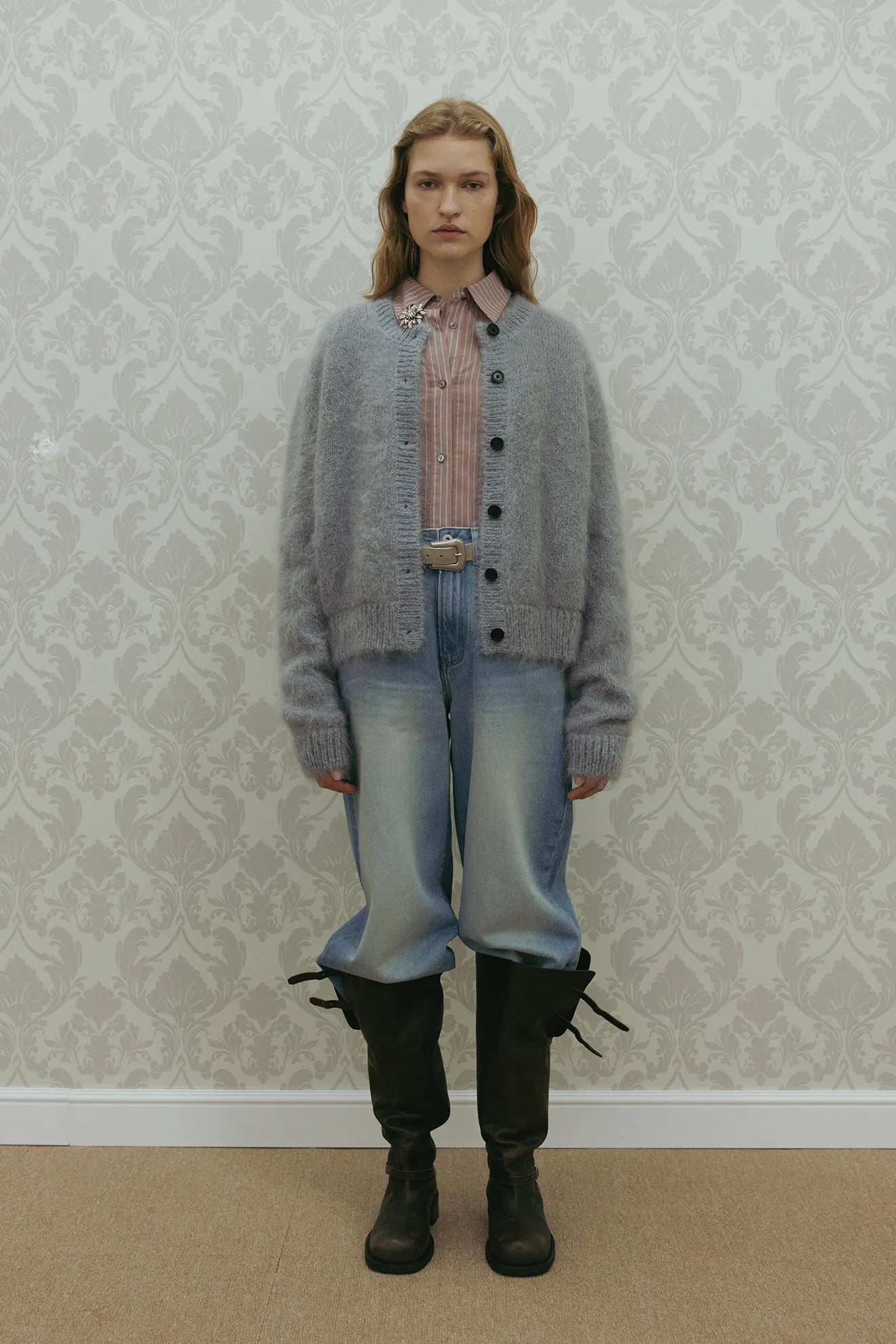 Model wearing Atelier Edition Cinch Back Denim Blue jeans