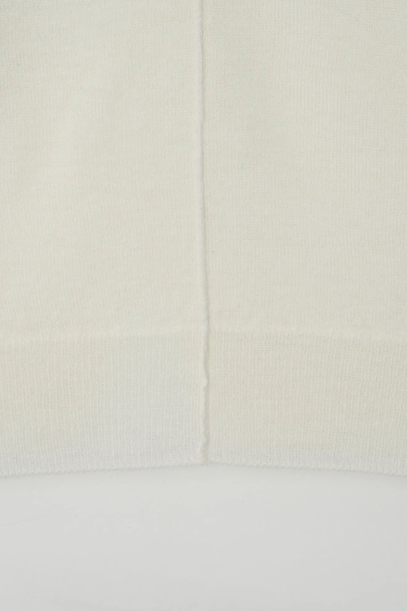 Atelier Edition Cut-Out Detail Wool Knit Top in Cream hem detail