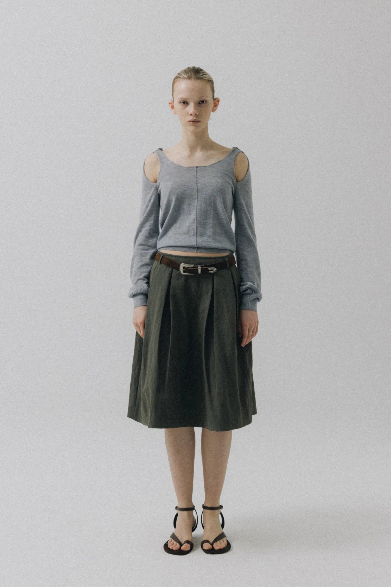 Model wearing Atelier Edition Cut-Out Detail Wool Knit Top in Cream