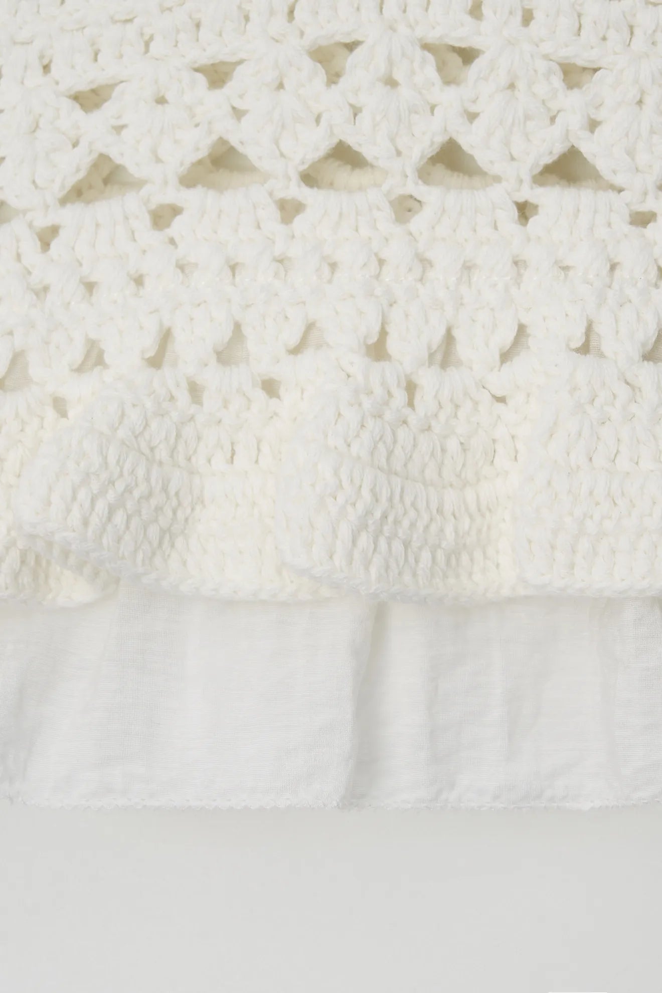 Hand-knitted texture and frill detail on Atelier Edition Bustier Ivory