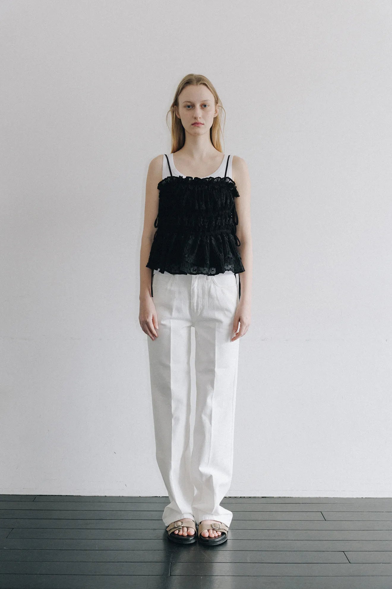 Model wearing Atelier Edition Shirring String Pleated Top in Black