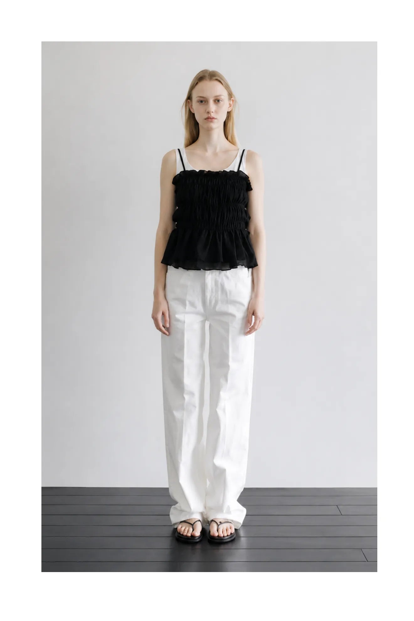 Model wearing Atelier Edition Shirring String Pleated Top in Black