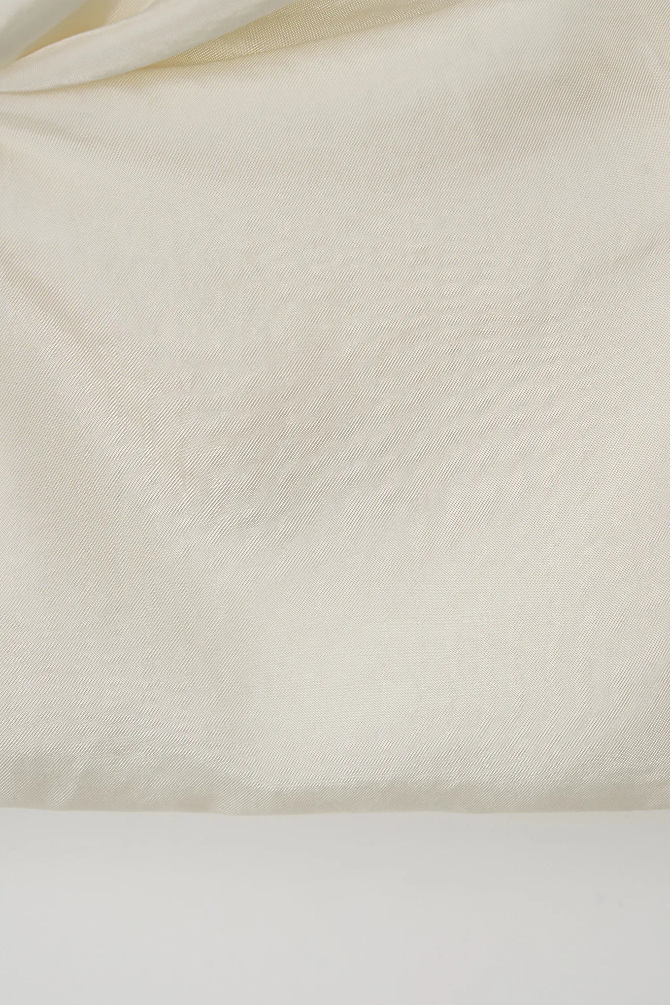 Fabric detail of Atelier Edition Sleeveless Flounce Blouse Cream