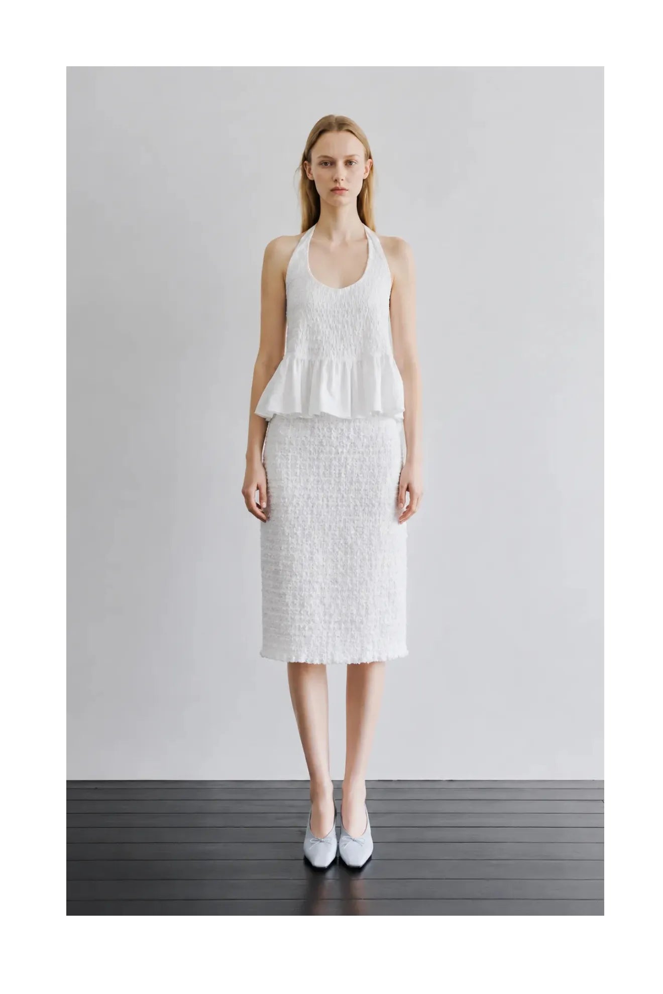 Model wearing Atelier Edition Smocked Banding Skirt in White