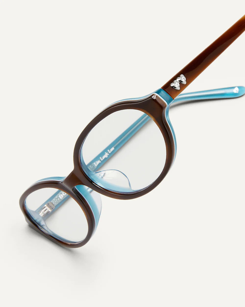 Angled view of Bonnie Clyde Baby Layered Teal Demi Clear