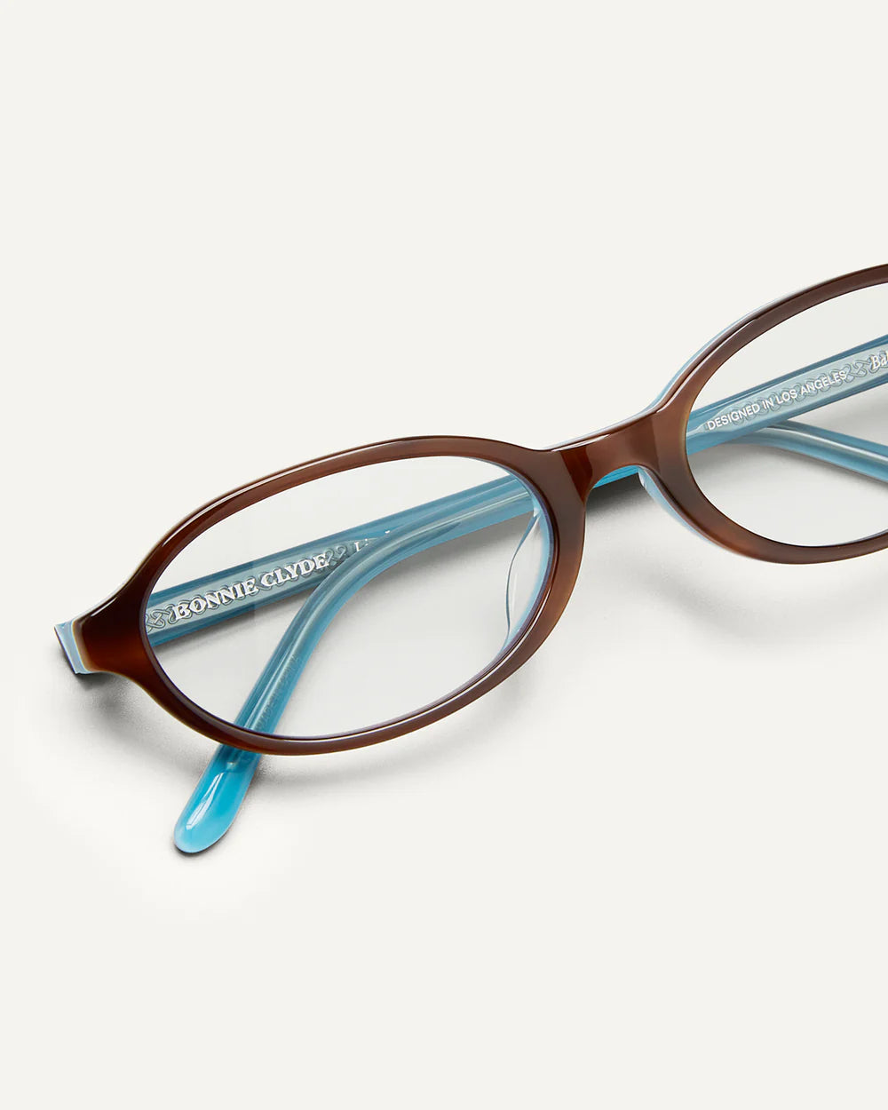Frame detail of Bonnie Clyde Baby Layered Teal Demi Clear