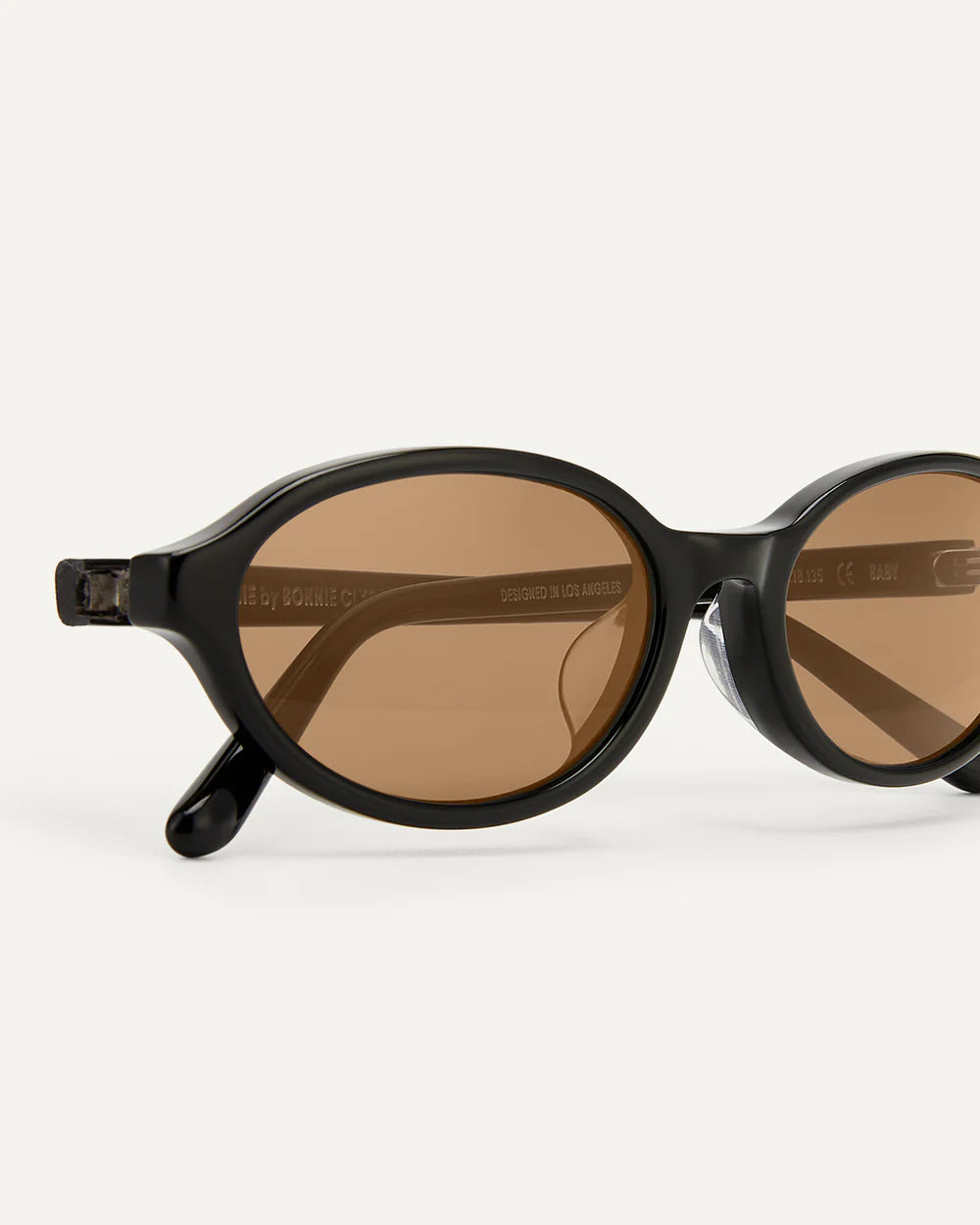 Bonnie Clyde baby sunglasses black brown minimal product shot oval frame