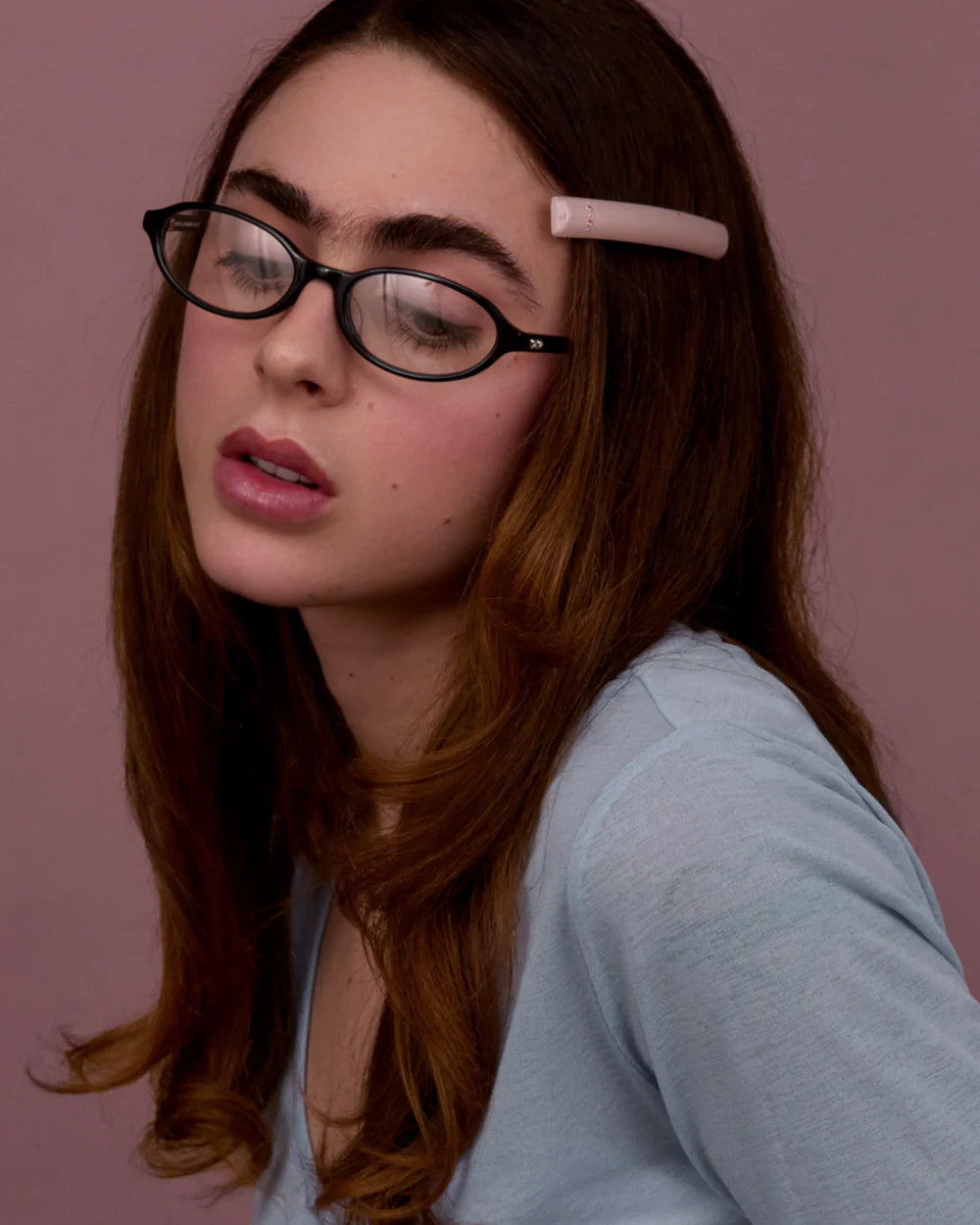 Model wearing Bonnie Clyde baby sunglasses black clear oval acetate frame