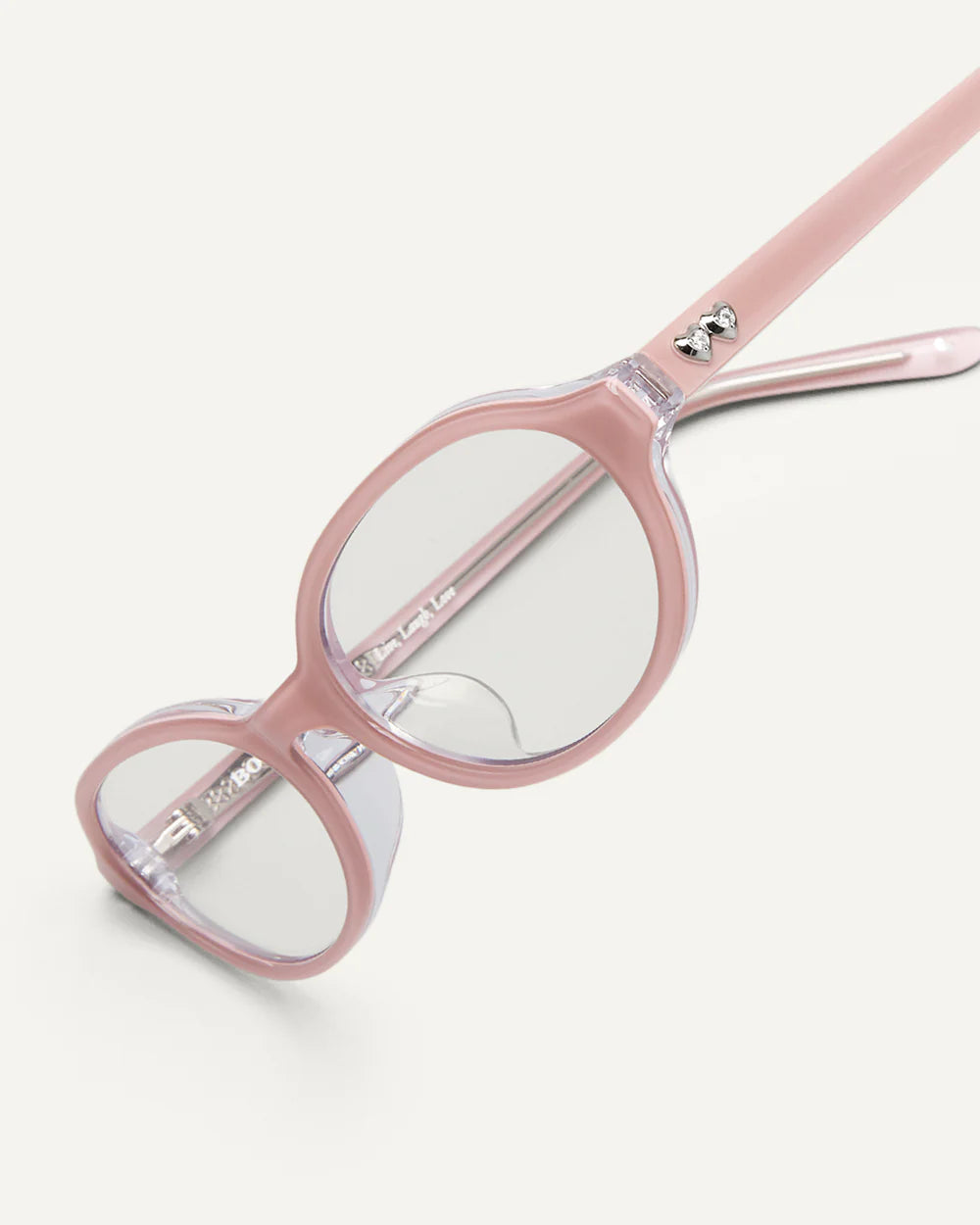Detail of Bonnie Clyde Baby sunglasses pink clear acetate frame slim temple design