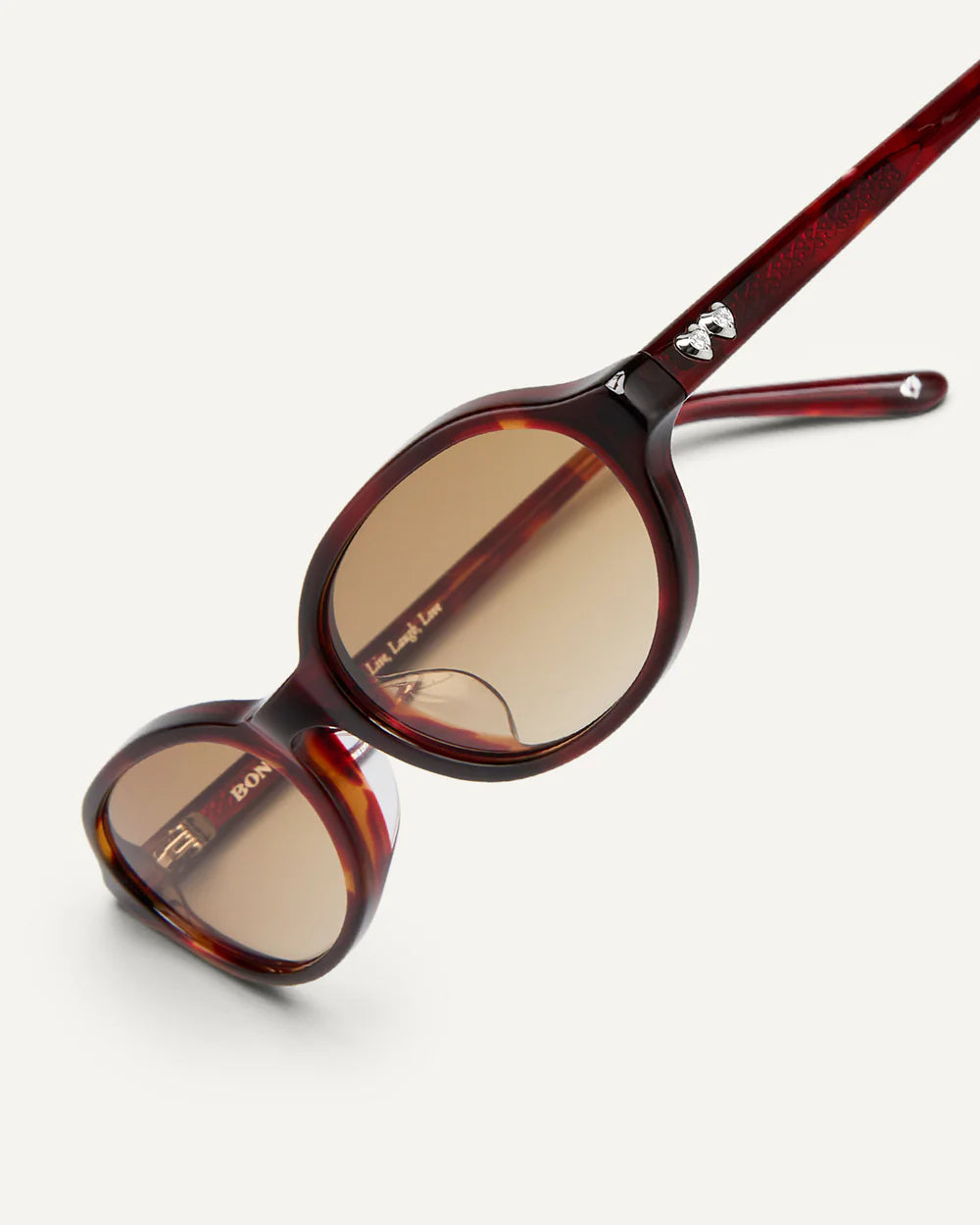 Angled view of Bonnie Clyde Baby Sunglasses Red Tortoise Brown Gradient