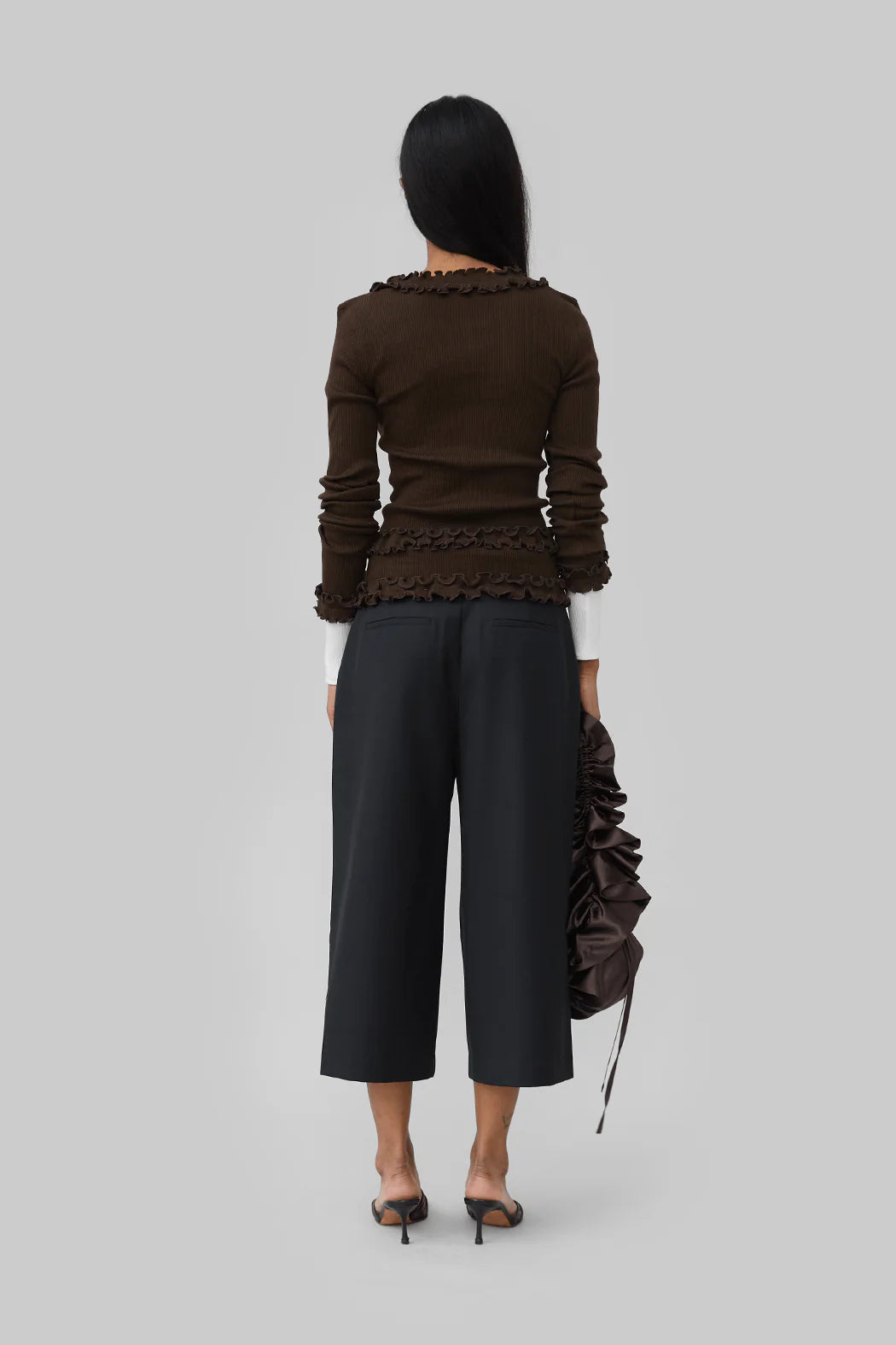 Back view of model wearing Caroline Seamless Cardigan in Brown