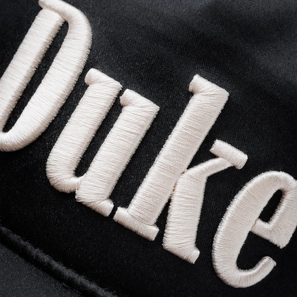 Embroidered logo detail of Duke + Dexter Duke Black Cap