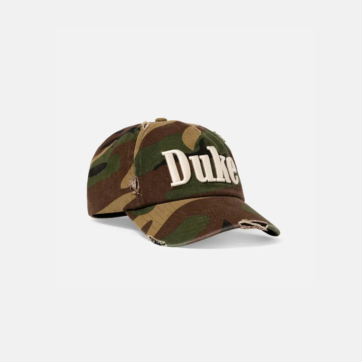 Angled view of Duke + Dexter Duke Camo Cap