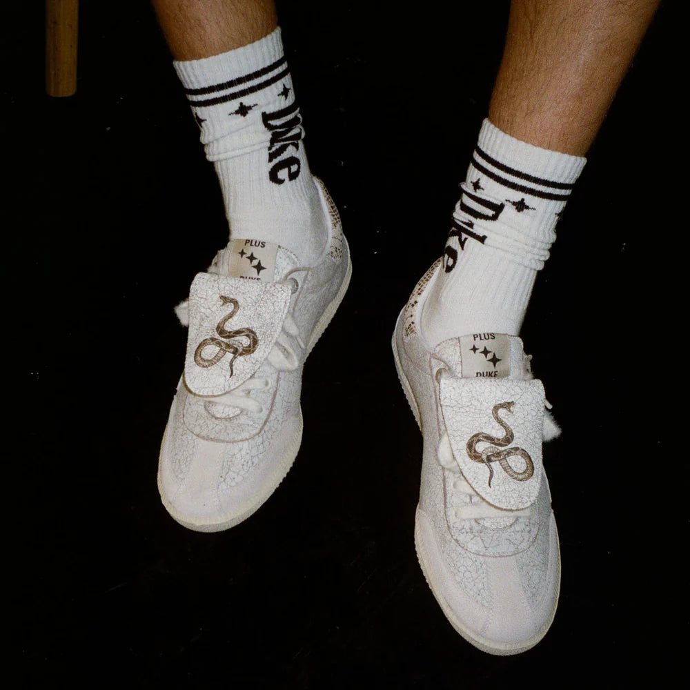 Model wearing Duke + Dexter Duke White + Black socks with sneakers