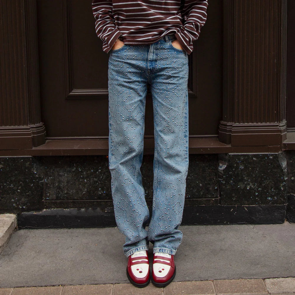 Model wearing Duke + Dexter Wilde Cherry Red Penny Loafers
