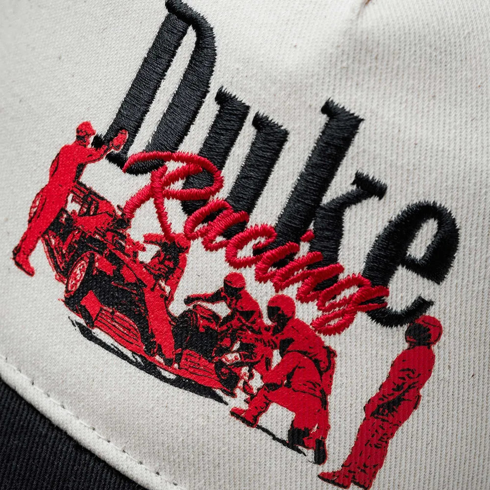 Embroidered graphic detail on Duke + Dexter Duke Pit Stop Cream Cap