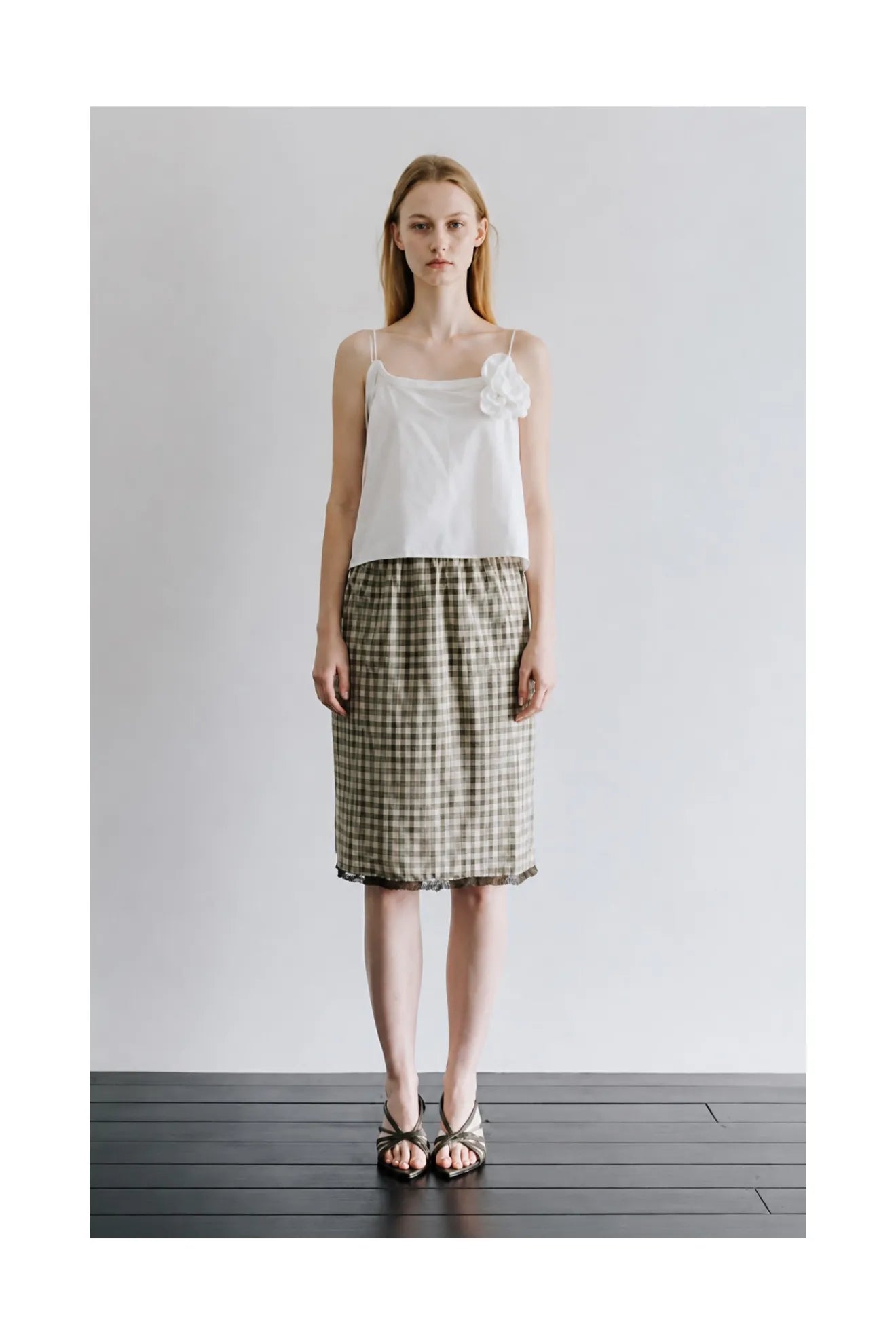 Model wearing Atelier Edition Embroidered Lace Check Skirt in Khaki