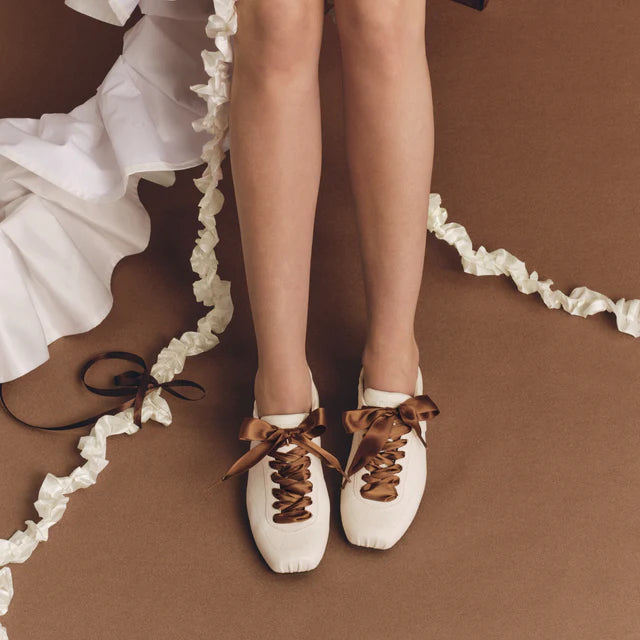 Model wearing Foot Industry Ballet Training White leather sneakers