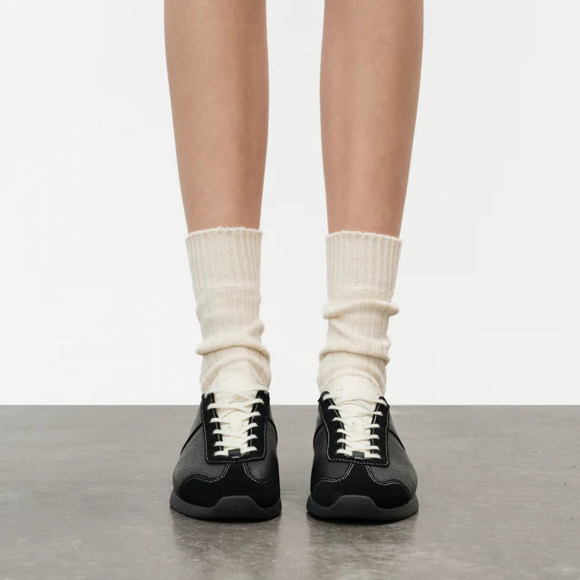Model wearing Foot Industry GAT Ballet Anthracite Antique White sneakers front view