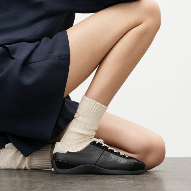 Model wearing Foot Industry GAT Ballet Anthracite Antique White sneakers