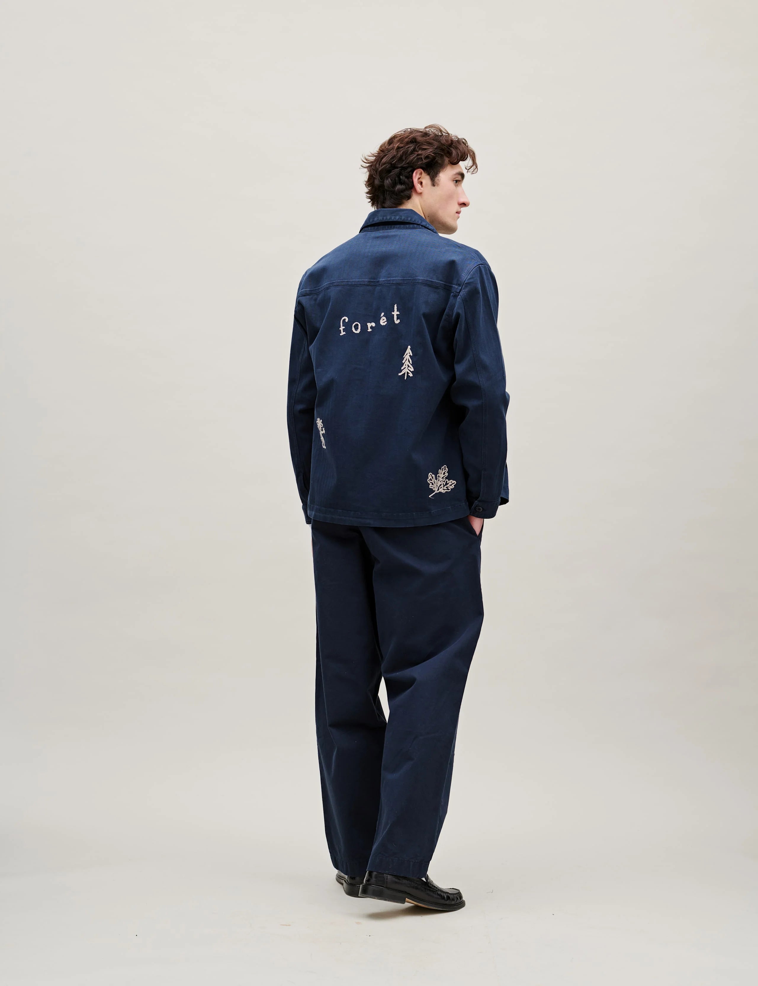 Back view of Foret Berry Herringbone Embroidery Overshirt in Navy worn