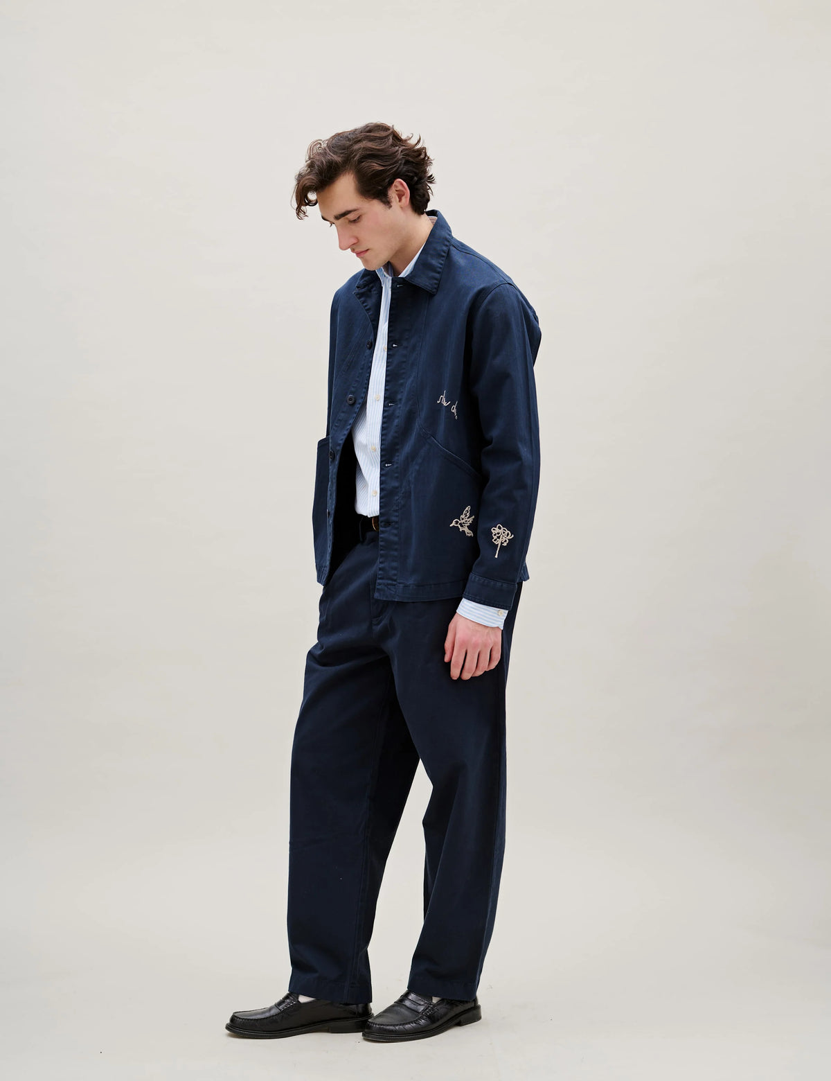 Side view of Foret Berry Herringbone Embroidery Overshirt in Navy worn