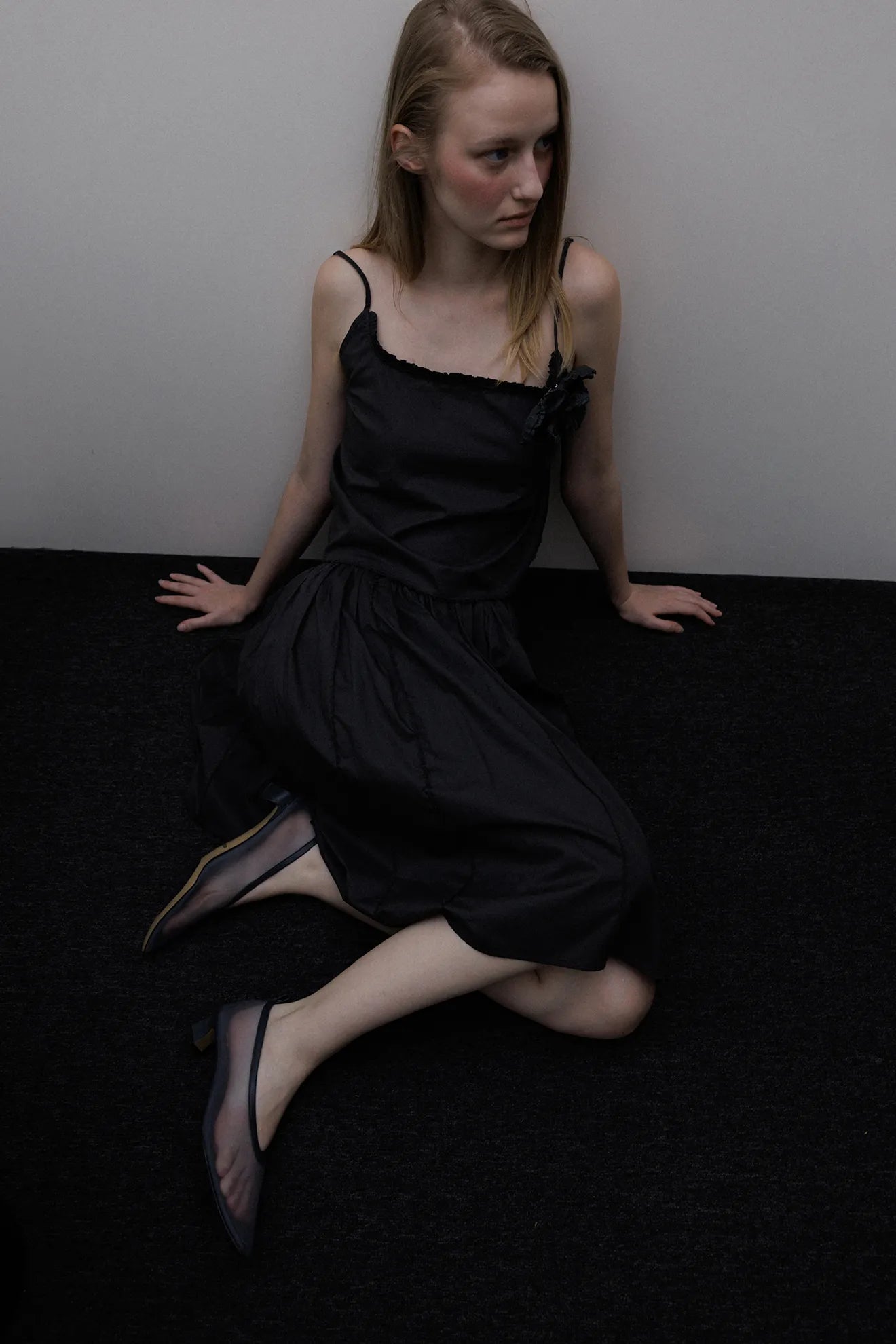 Model wearing Frilled and Embroidered Blouse in Black