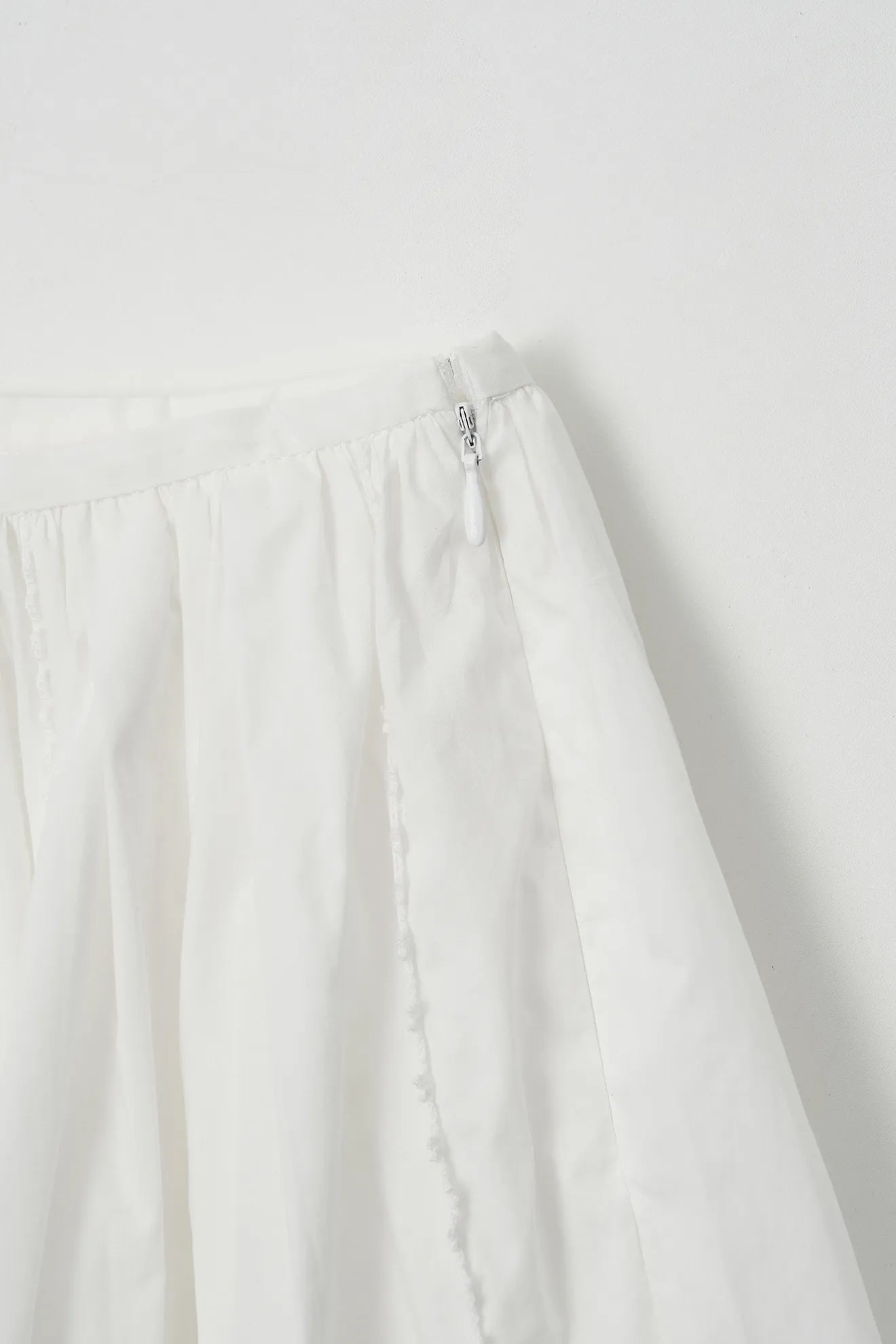 Side detail of Frilled and Embroidered Skirt in White