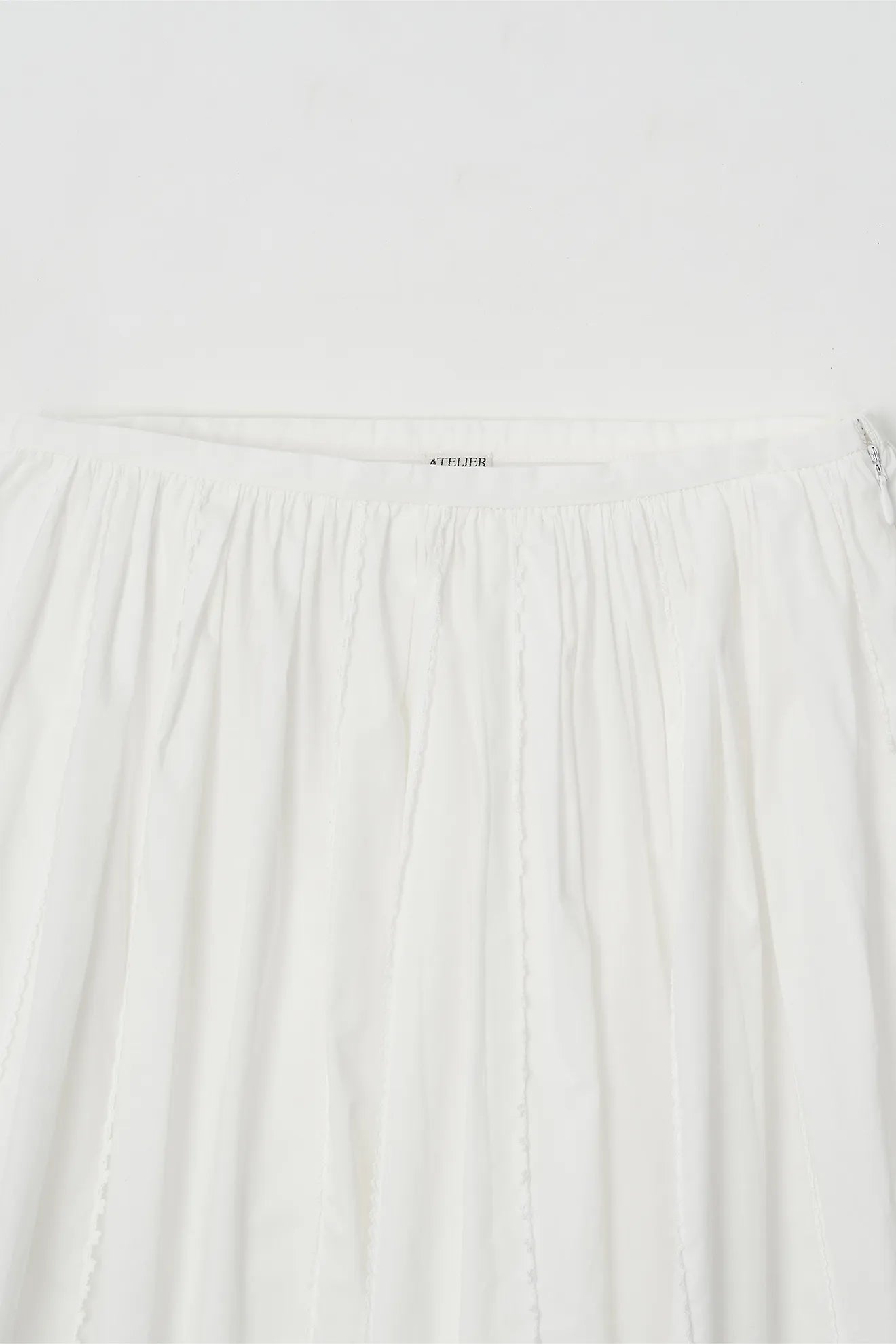 Gathered waist detail of Frilled and Embroidered Skirt in White