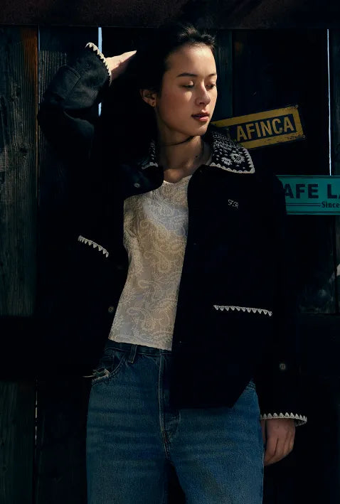 Model wearing FRITUR Embroidery Collar Jacket in Black