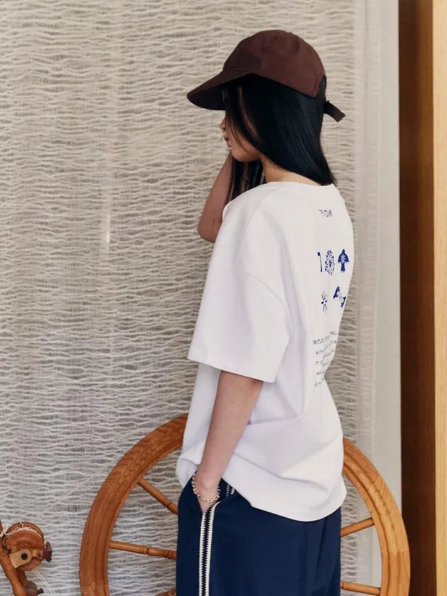 Profile view of model wearing FRITUR Icon Ball Cap in Brown