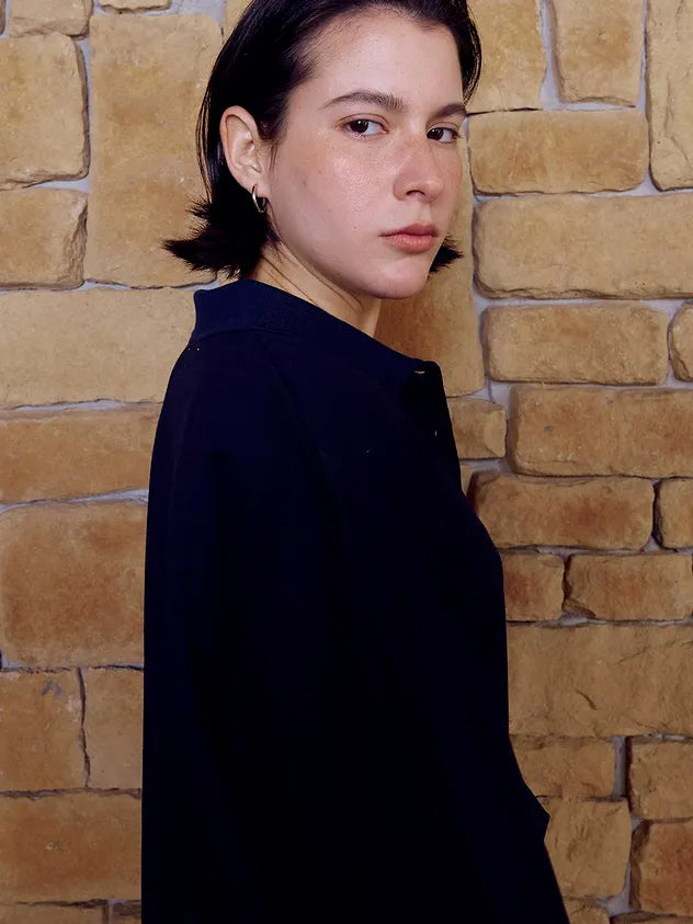 Side profile of model wearing FRITUR Languid Pique Shirt in Navy