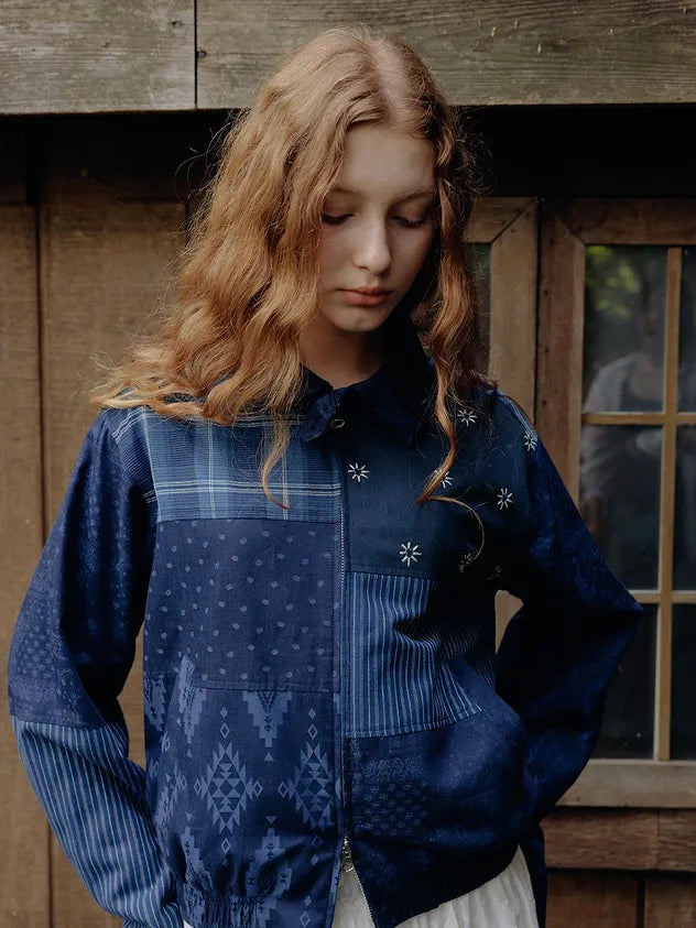 Woman wearing FRITUR Signature Patchwork Bomber Jacket in Navy