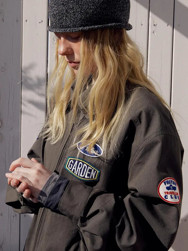 Close-up of model wearing FRITUR Traveller Bomber Jacket in Khaki