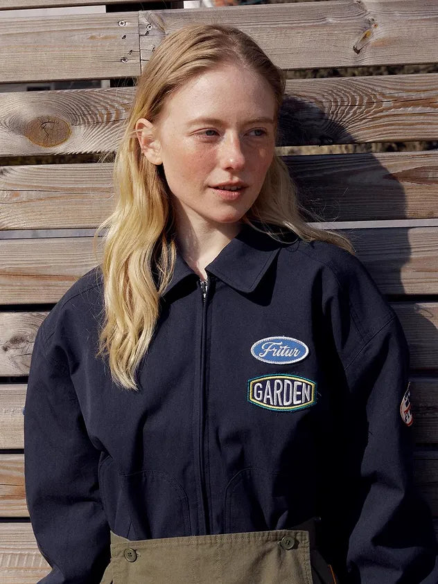 Chest logo detail of FRITUR Traveller Bomber Jacket in Navy