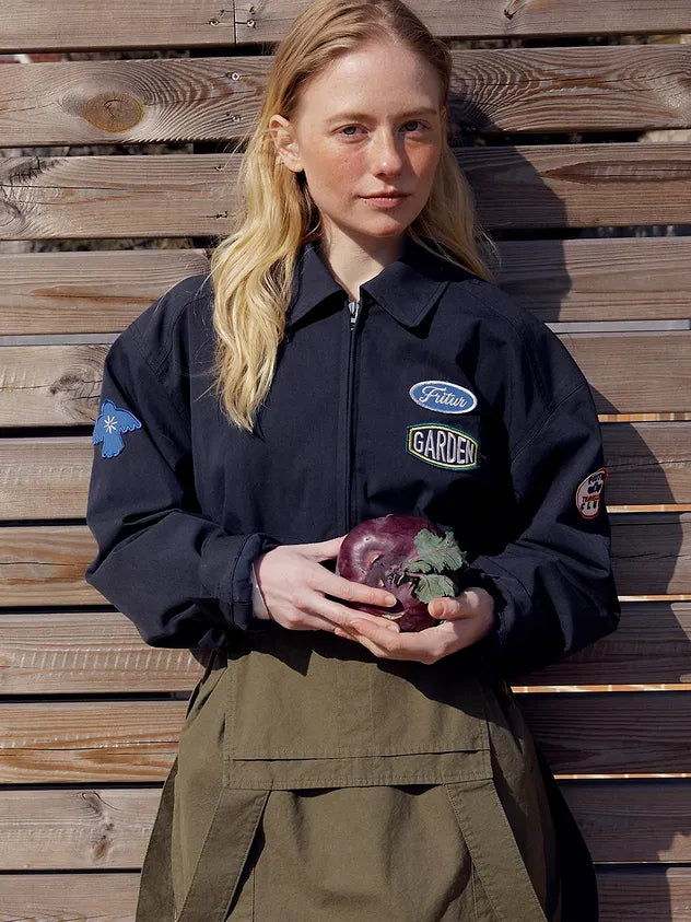 Close-up of model wearing FRITUR Traveller Bomber Jacket in Navy