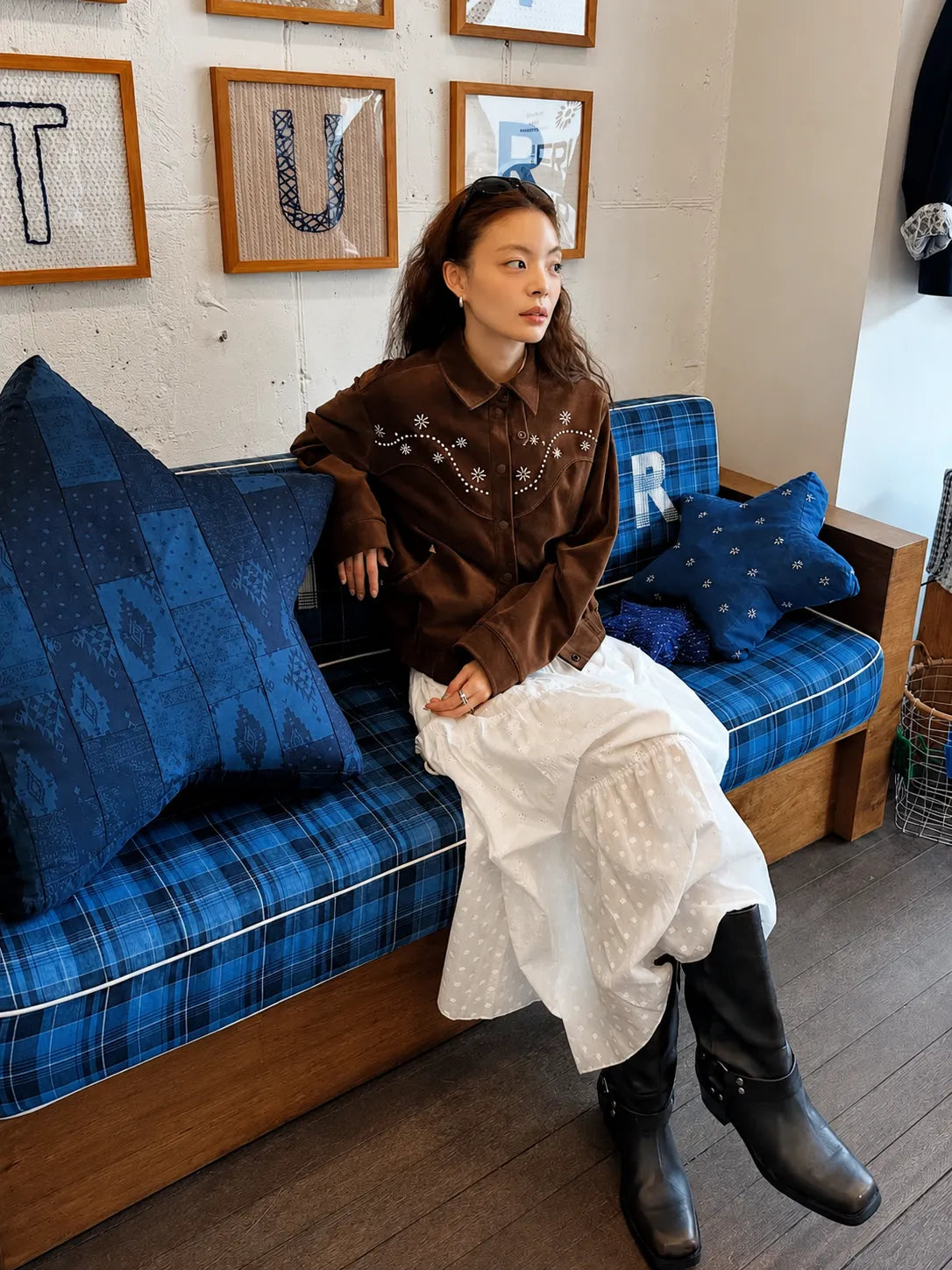 Model wearing FRITUR Western Embroidery Bomber Jacket in Brown indoors