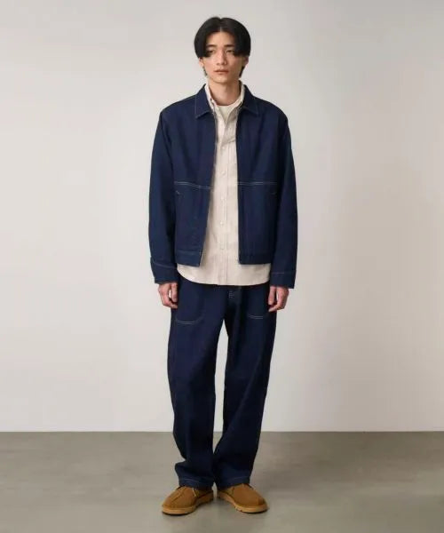 Model wearing Gramicci Men's Japanese Slub Denim Jacket in Indigo