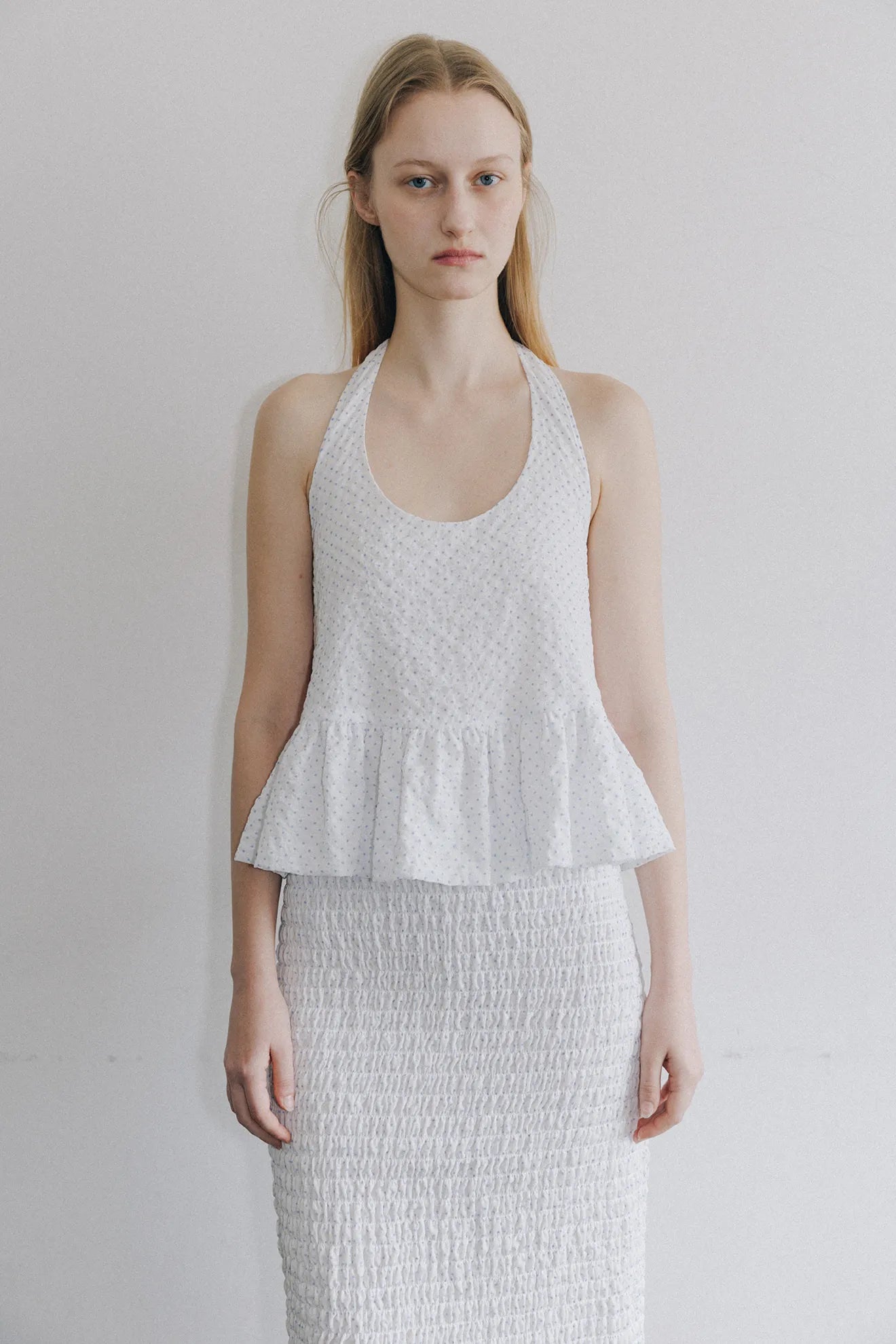 Model wearing Halterneck Peplum Blouse in White
