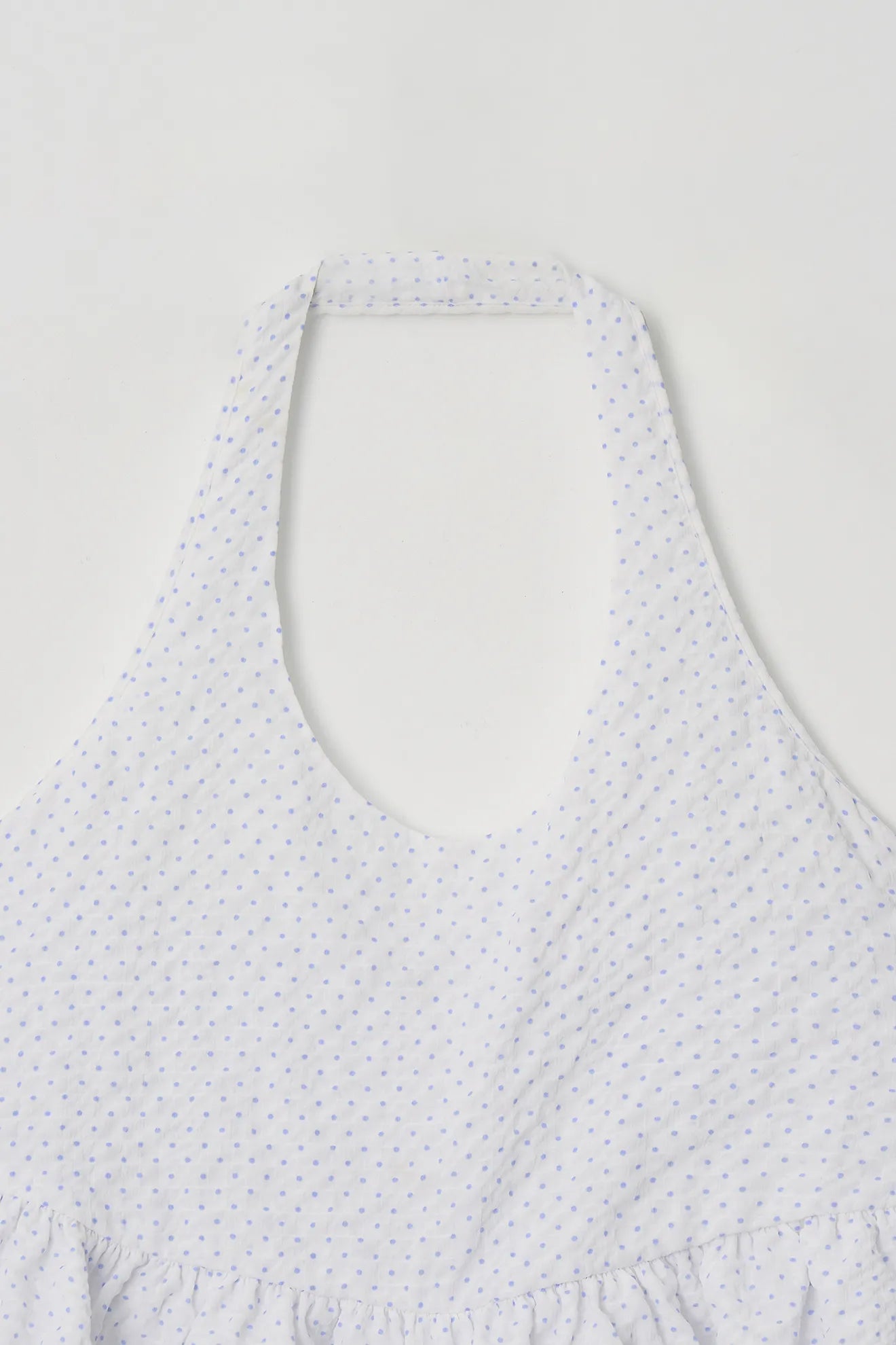 Halterneck neckline detail of Halterneck Peplum Blouse in White