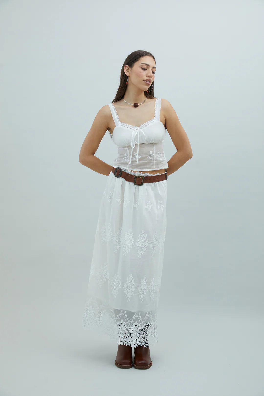 Model wearing House of Sunny Blossom Top Ivory with matching skirt