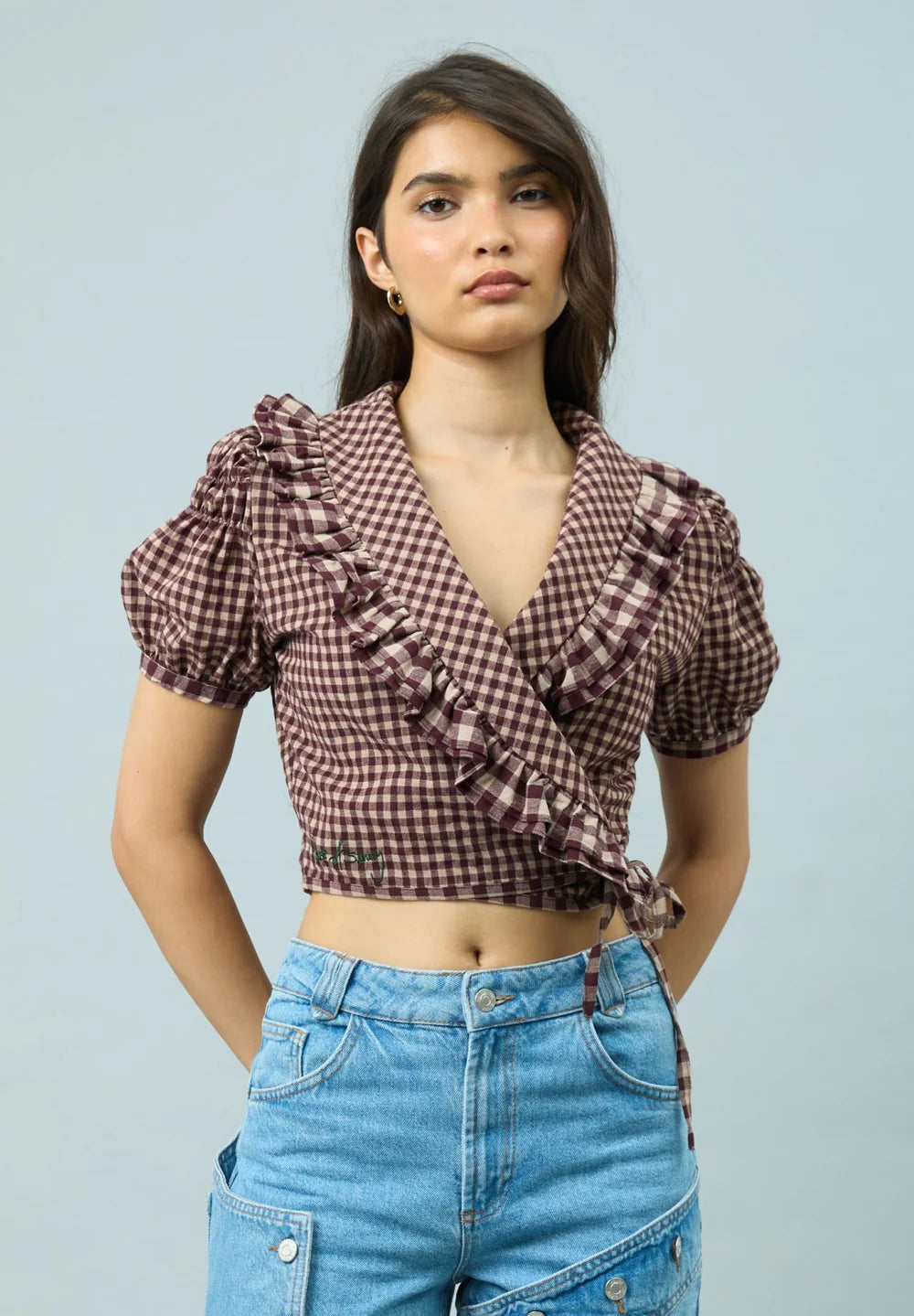 Front view of model wearing House of Sunny Gingham Ruffle Top
