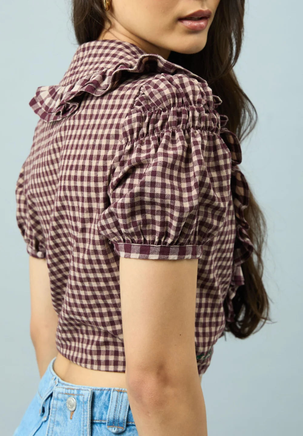 Puff sleeve detail of House of Sunny Gingham Ruffle Top
