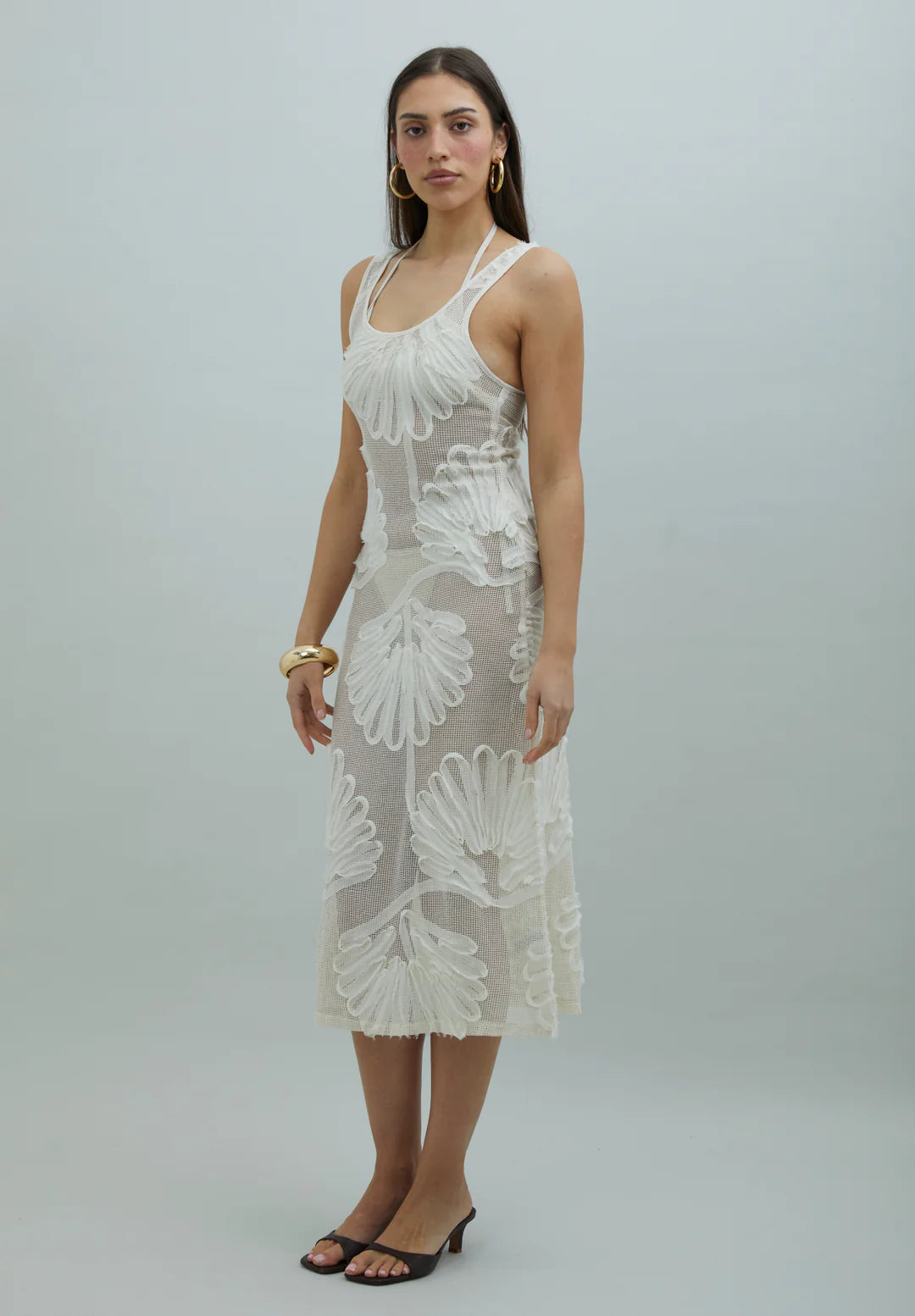 Three-quarter view of House of Sunny Seashells Appliqué Hockney Dress in Ivory