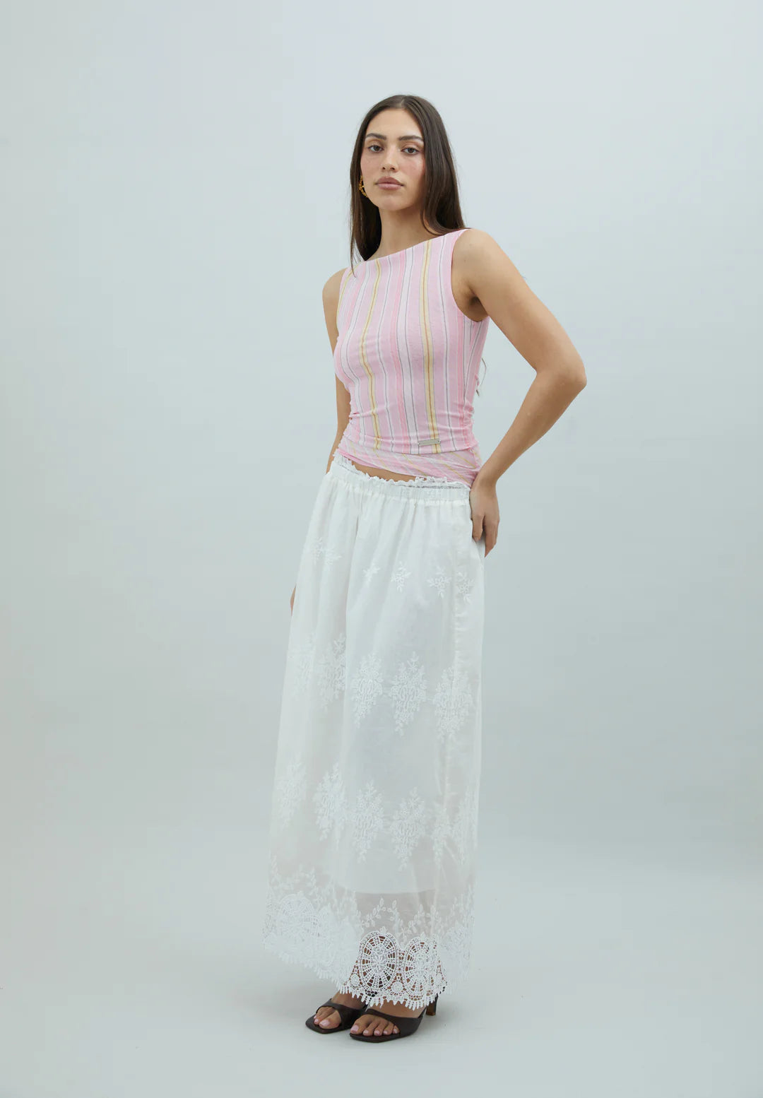 Three-quarter view of House of Sunny Striped Mesh Top in Blush