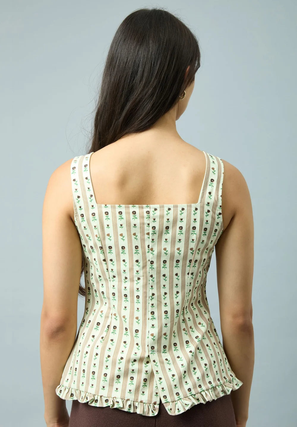 Back view of model wearing House of Sunny Vintage Rose Top in Oat