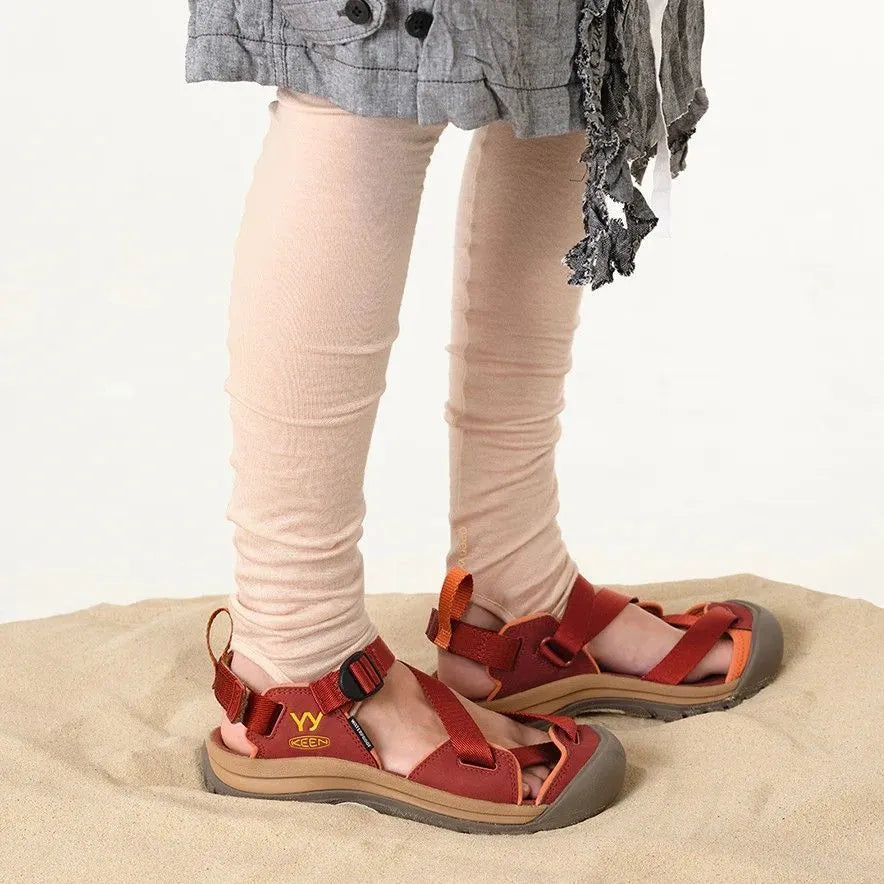 Model wearing KEEN x OPEN YY Zerraport Women’s sandals in Burnt Henna