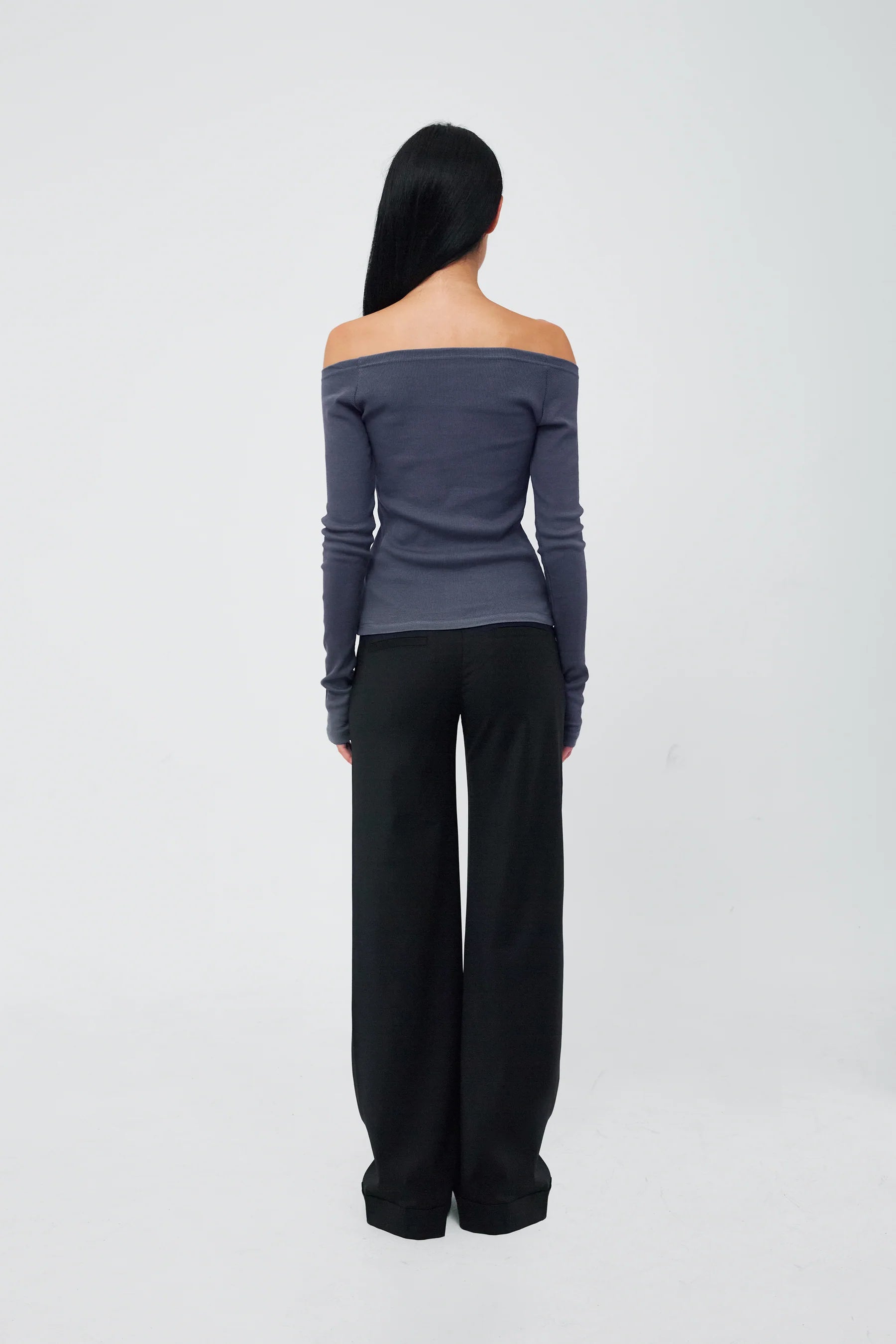 Back view of Kernemilk Matilda Cardigan in Dusty Blue worn
