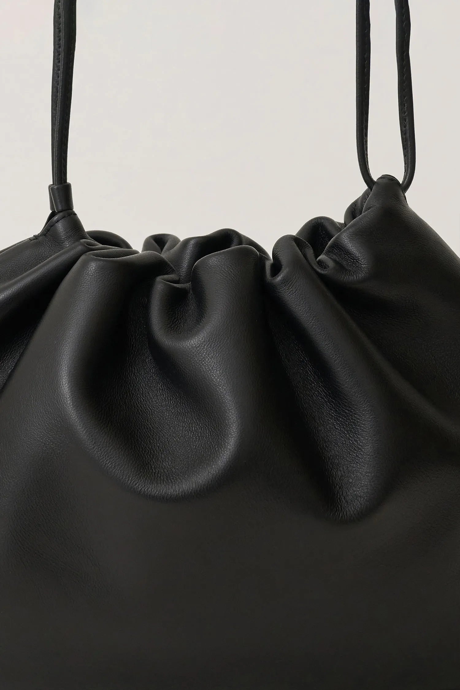 Drawstring detail of Nella Strap Large Bag in Black