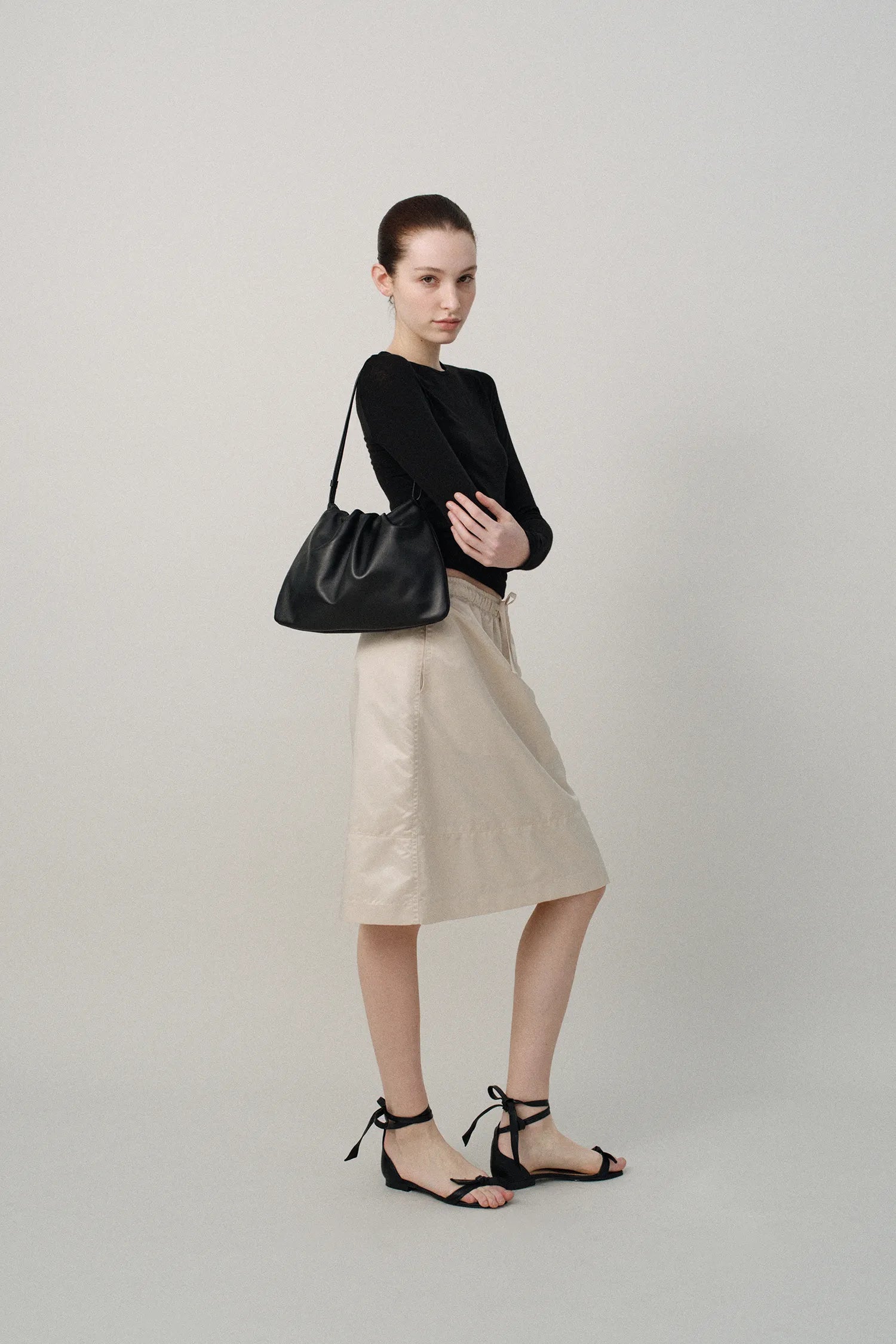 Model wearing Nella Strap Large Bag Black front view